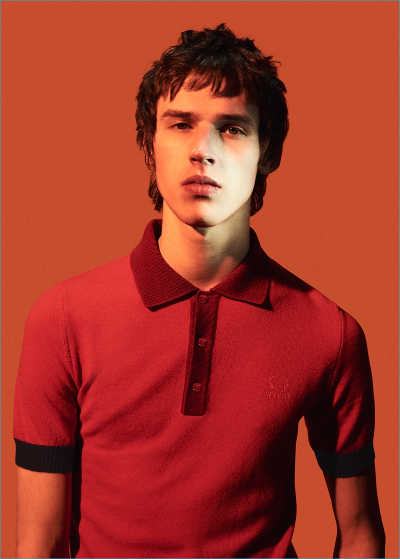 Raf Simons for Fred Perry turns out a red fitted polo shirt with a knit collar for fall-winter 2016.