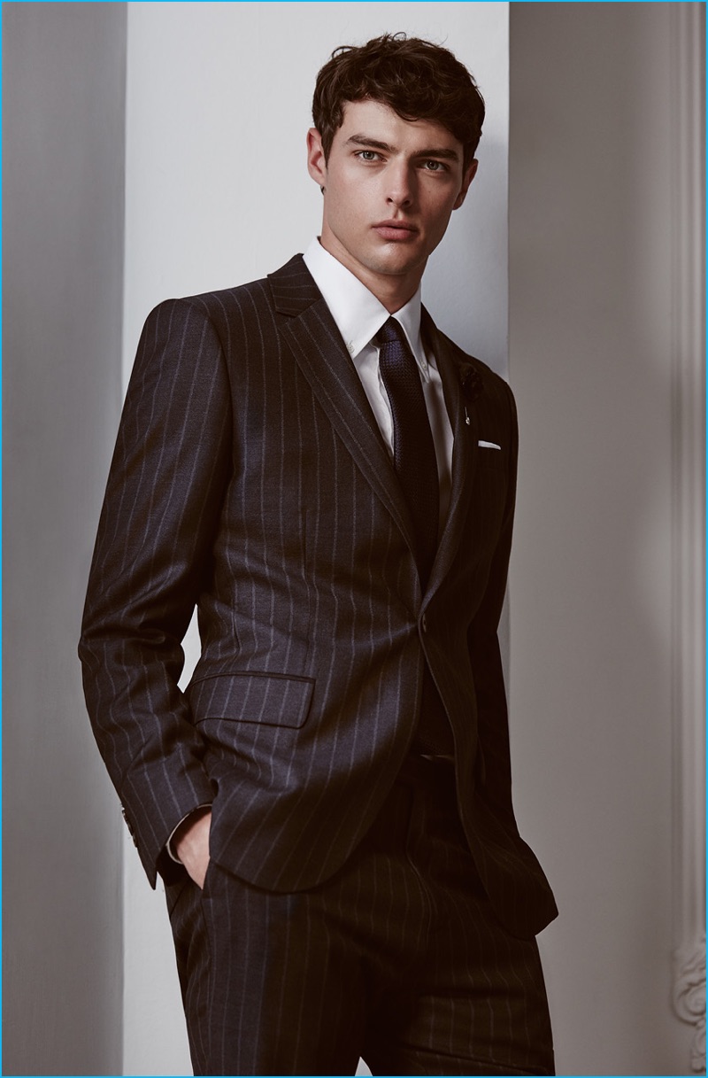 Hannes Gobeyn dons a pinstripe suit from Reiss' fall-winter 2016 tailoring collection.