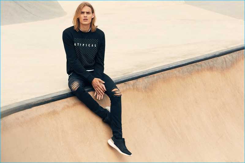 Ton Heukels rocks ripped denim jeans and a pullover from Lefties' Skate Republic collection.