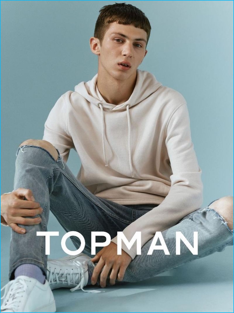 Topman goes skaterboy casual with a hoodie and ripped denim jeans for fall.