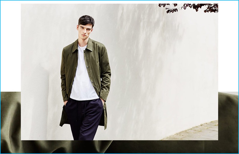 Topman embraces the mac coat, dressing up a simple tee and pinstripe pants for an effortless look.