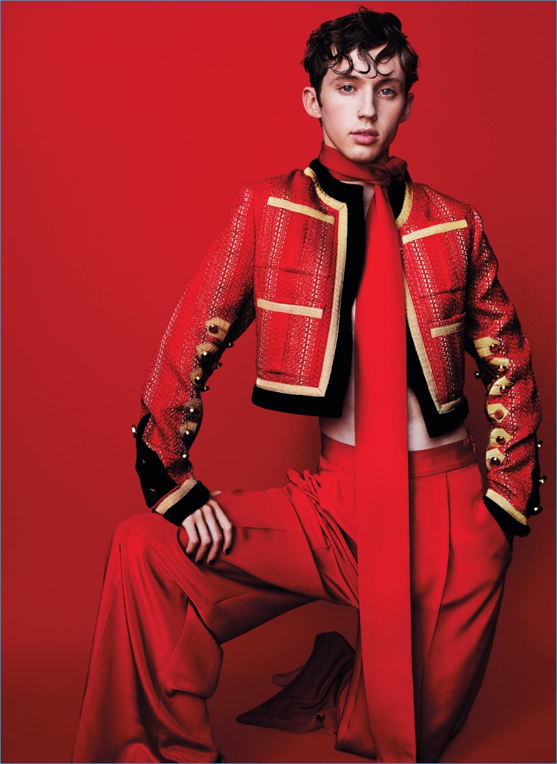 Troye Sivan pictured in a red hot look from Parisian fashion house Givenchy.