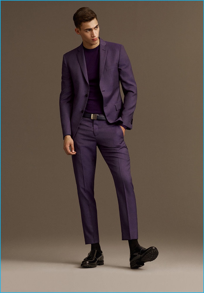 Alessio Pozzi makes a bold statement in a purple suit from Versace's fall-winter 2016 collection.