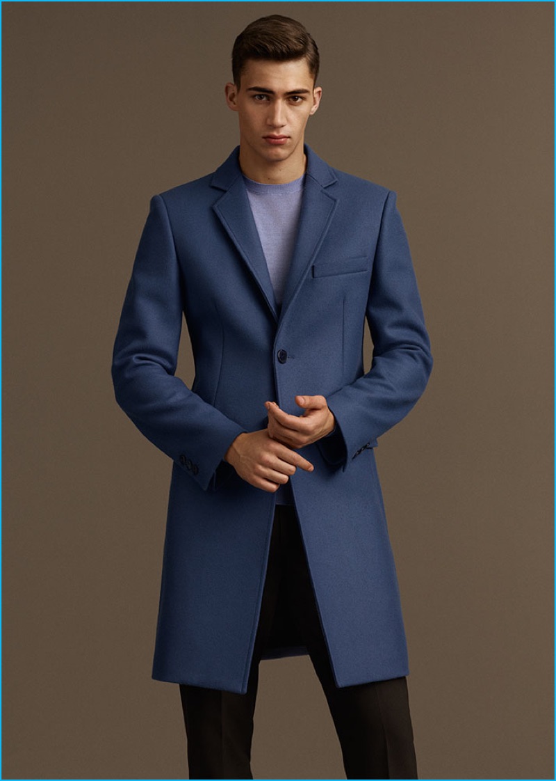 Alessio Pozzi pictured in a sharp blue overcoat from Versace's fall-winter 2016 collection.