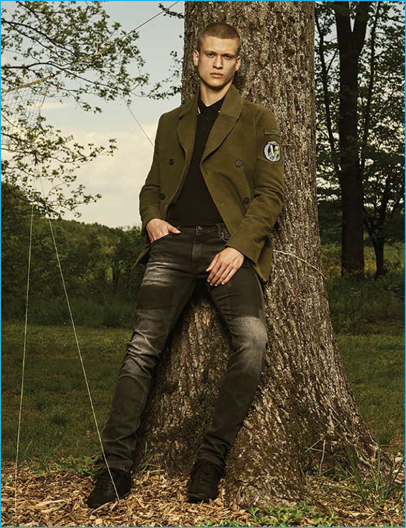 Model Zack Riddle fronts Versace Jeans' fall-winter 2016 men's outing.