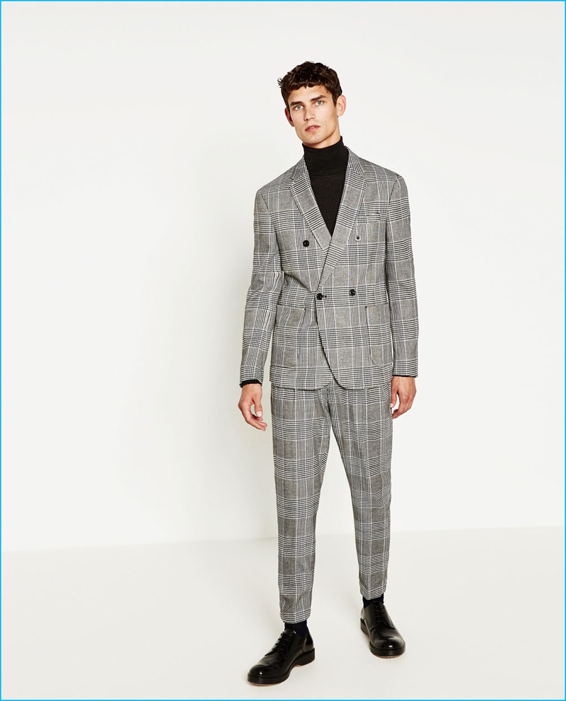 Arthur Gosse sports a double-breasted check suit from Zara Man with a chic turtleneck.