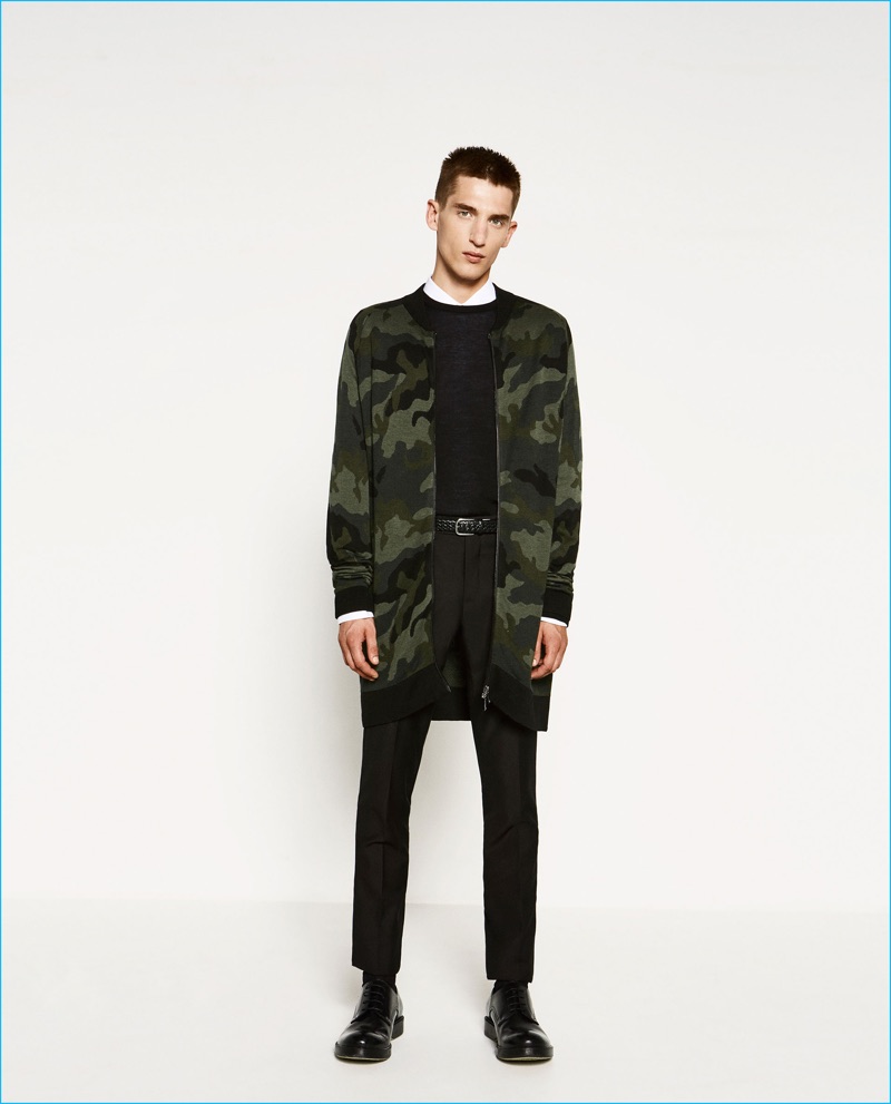 Anatol Modzelewski is pictured in an elongated camouflage knit bomber jacket from Zara Man.