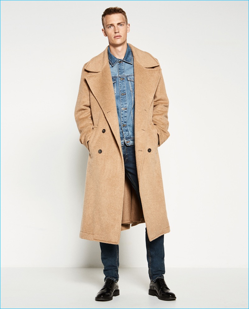 Victor Nylander embraces the oversized trend in a camel hued coat from Zara Man.