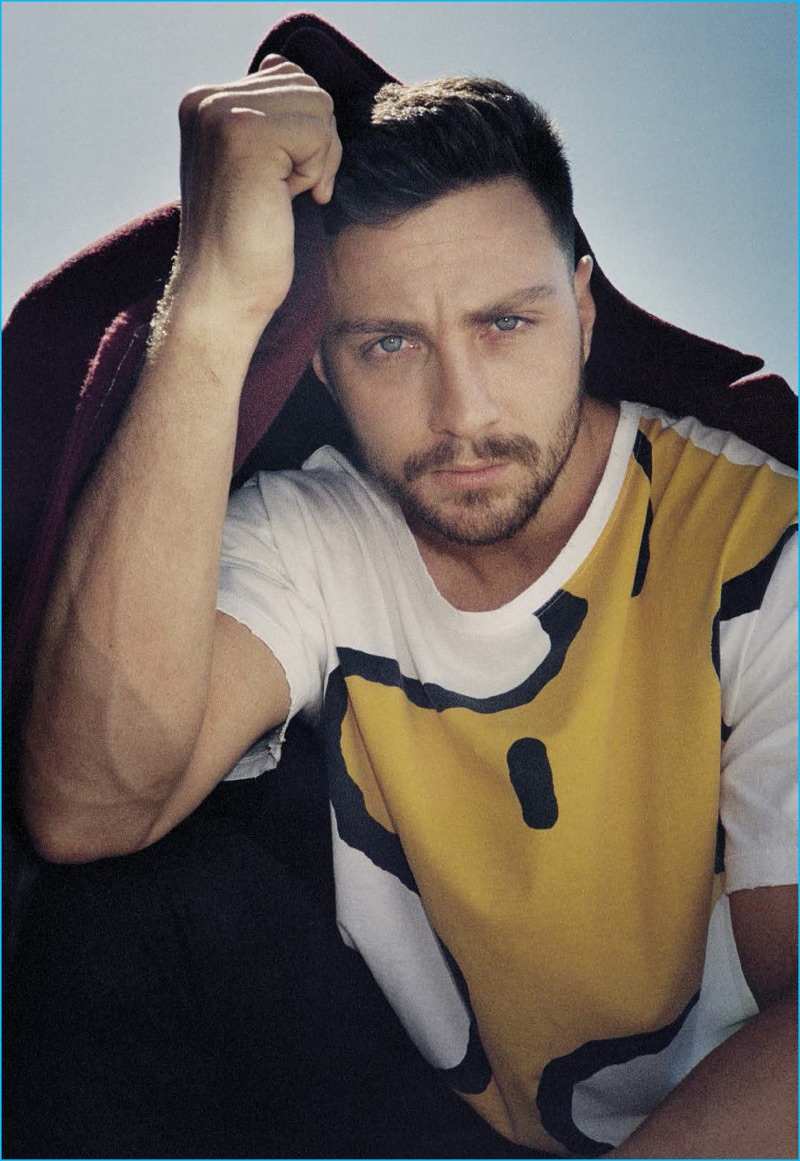 Aaron Taylor-Johnson sports a Lanvin coat with a Gucci Woodstock t-shirt.