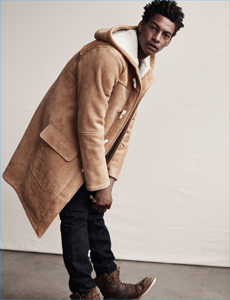 Ty Ogunkoya dons a shearling lined parka for Abercrombie & Fitch's fall-winter 2016 men's campaign.