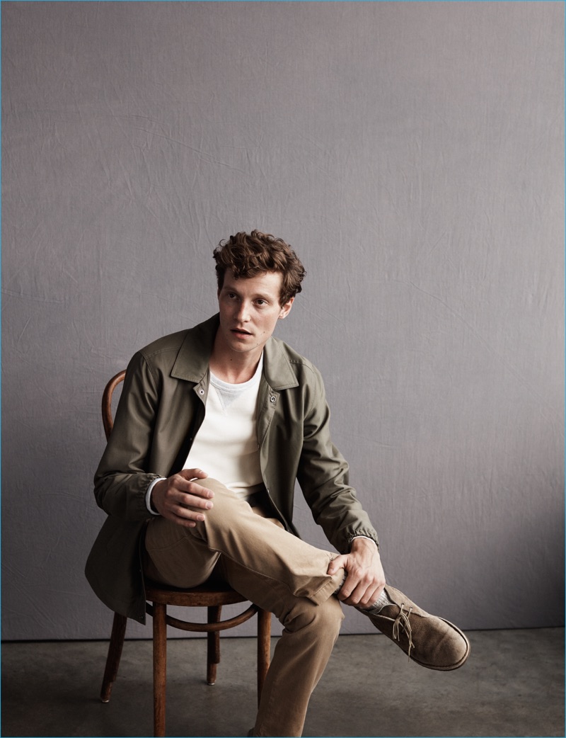 Matthew Hitt is pictured in an army green jacket and khaki pants for Abercrombie & Fitch's fall-winter 2016 men's campaign.