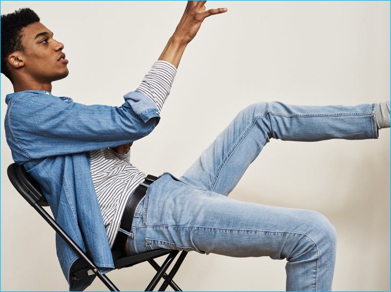 Sporting a long sleeve striped tee, model Darius Johnson doubles down on denim for a classic relaxed look from Abercrombie & Fitch.