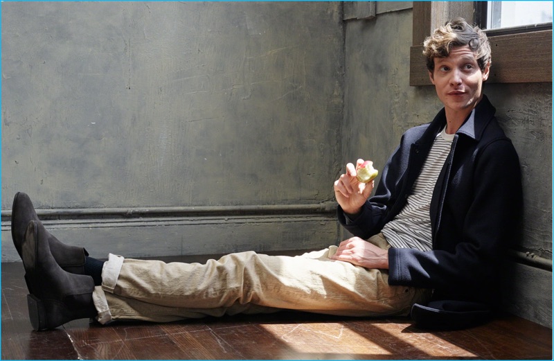 Matthew Hitt chills in a striped tee with selvedge straight jeans and an essential navy peacoat from Abercrombie & Fitch