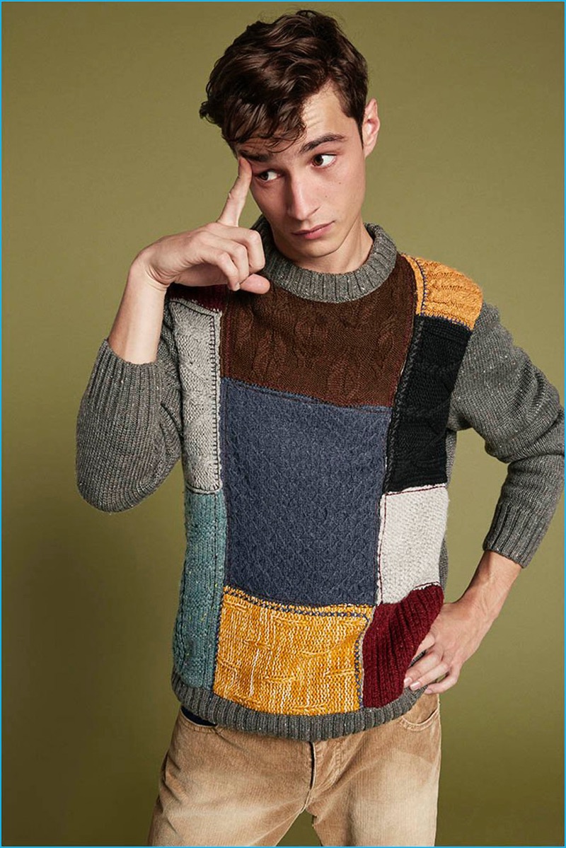 Adrien Sahores wears a colorful patchwork sweater from Desigual's fall-winter 2016 collection.
