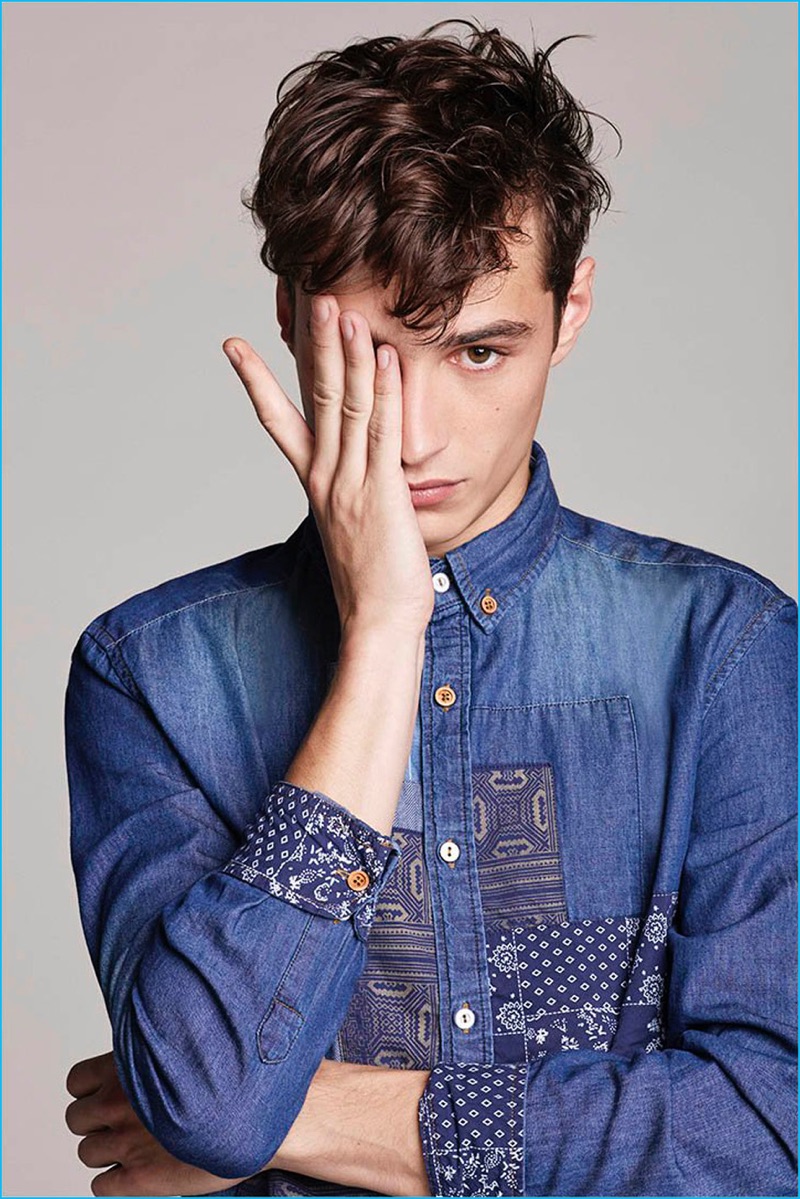 Adrien Sahores pictured in a distressed denim shirt from Desigual's new men's collection.