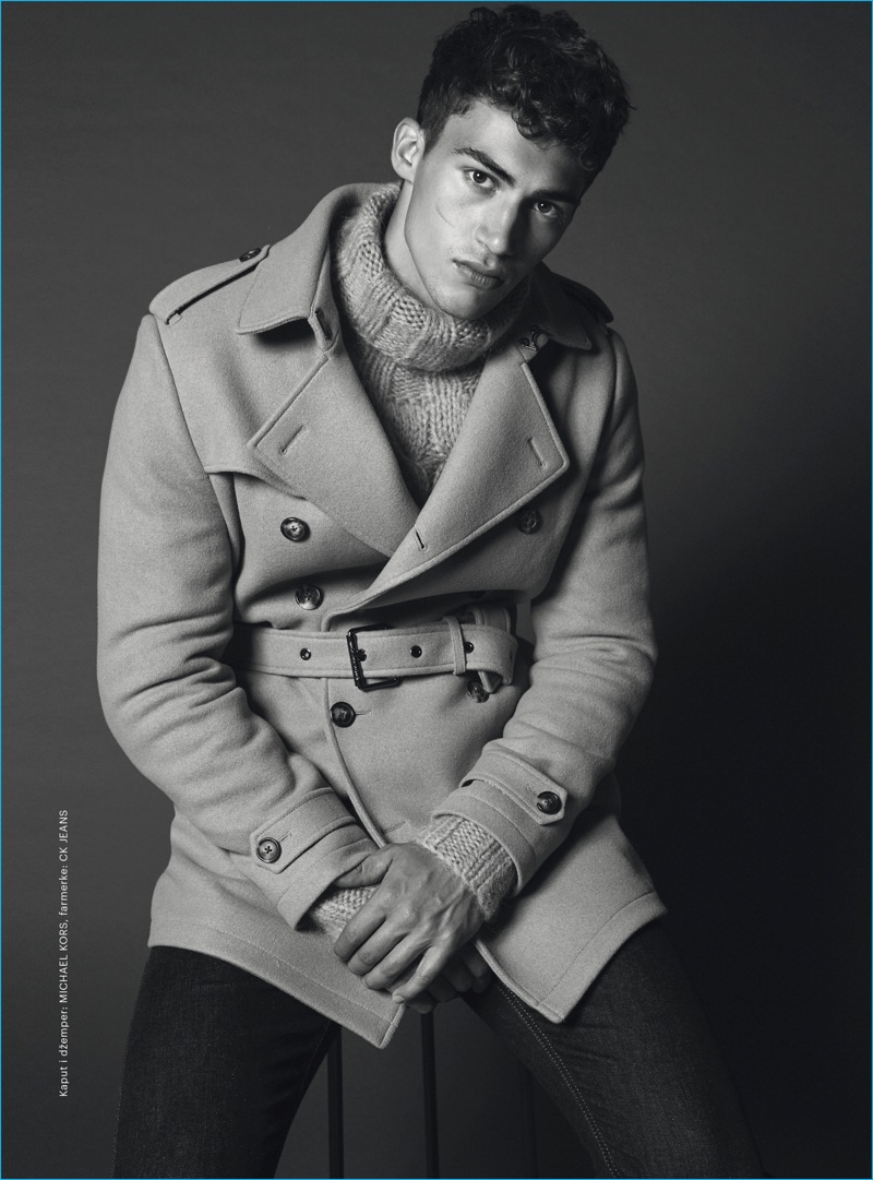 Alessio Pozzi dons a Michael Kors belted double-breasted coat and turtleneck sweater with Calvin Klein jeans for Esquire Serbia.