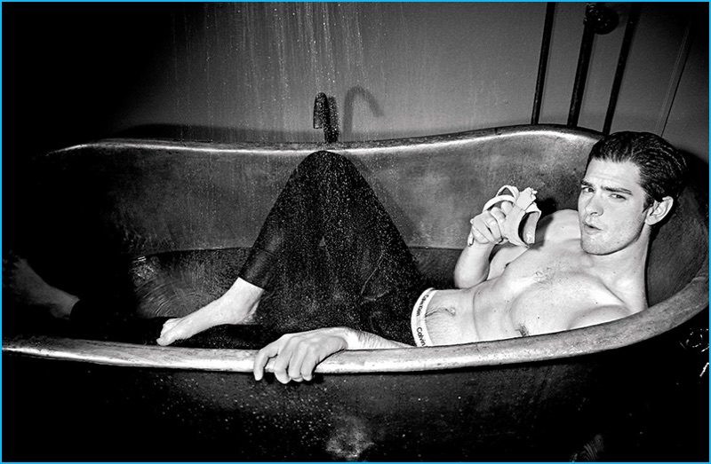 Going shirtless, Andrew Garfield takes a soak in Calvin Klein for L'Uomo Vogue.