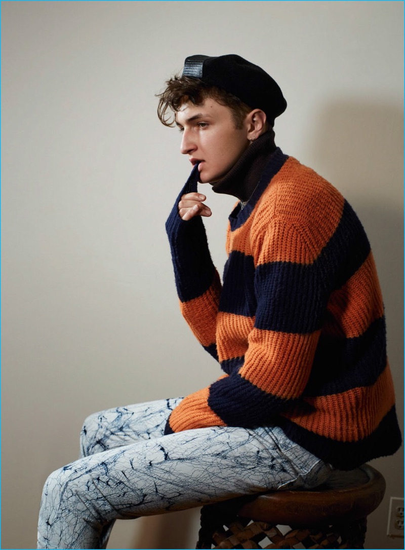 Anward Hadid sports a orange and navy striped sweater from MSGM for Vogue Hommes Paris.