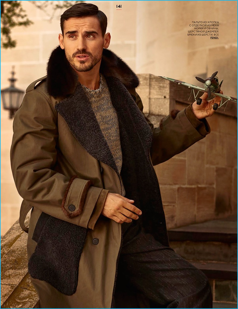 Arthur Kulkov touches on military-inspired style in an oversized fur trimmed coat with epaulets from Fendi.