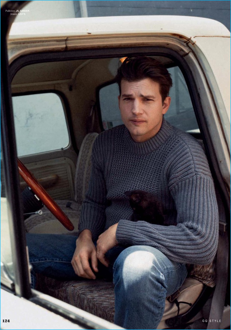 Ashton Kutcher pictured in a Jil Sander knit sweater and Levi's jeans for GQ Style Germany.