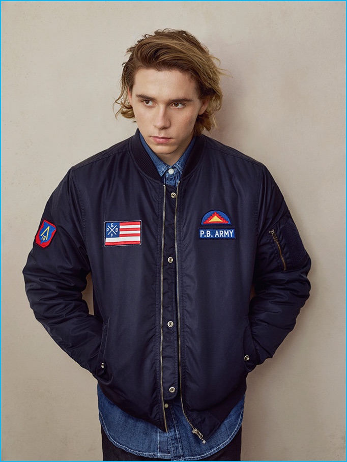 Brooklyn Beckham dons a sporty bomber jacket from Pull & Bear.