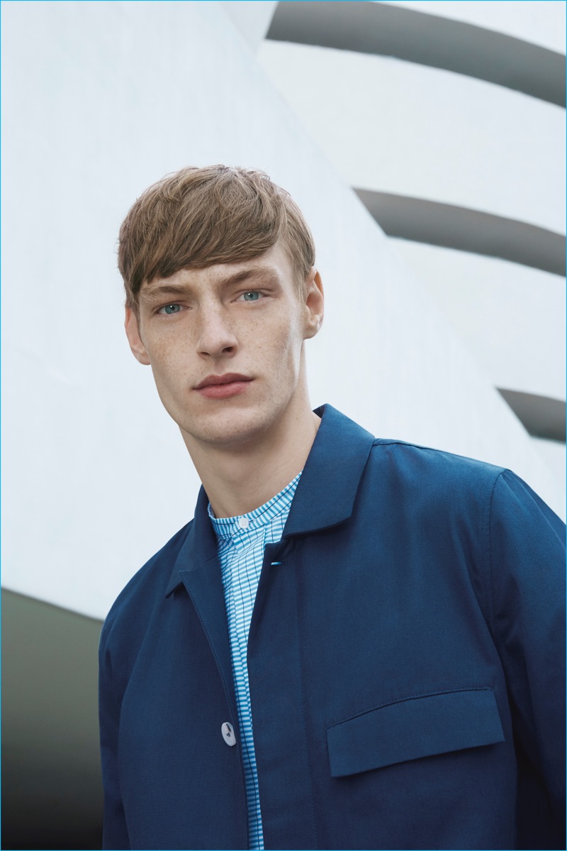 Model Roberto Sipos wears a canvas jacket and collarless shirt from the COS x Agnes Martin collection.