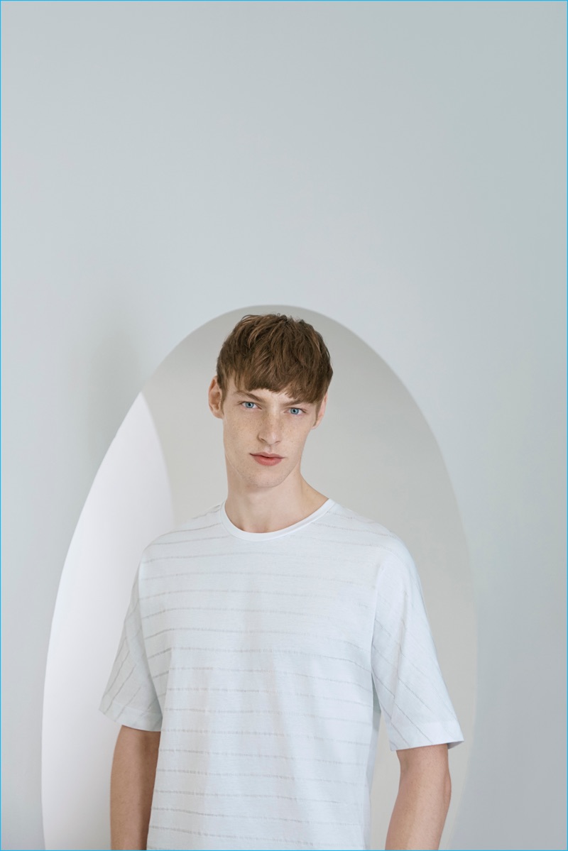 Roberto Sipos dons a unisex shirt from the COS x Agnes Martin collection.
