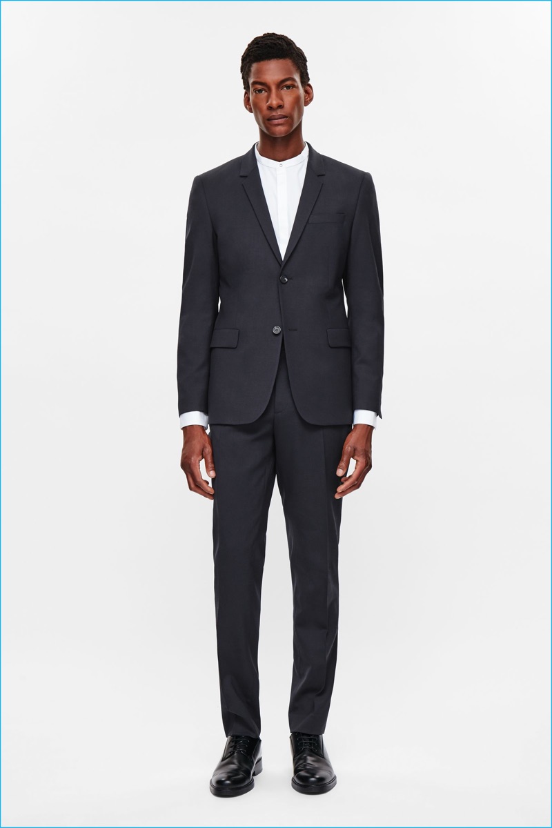 Ty Ogunkoya dons a lightweight wool suit from COS' fall-winter 2016 men's essentials collection.