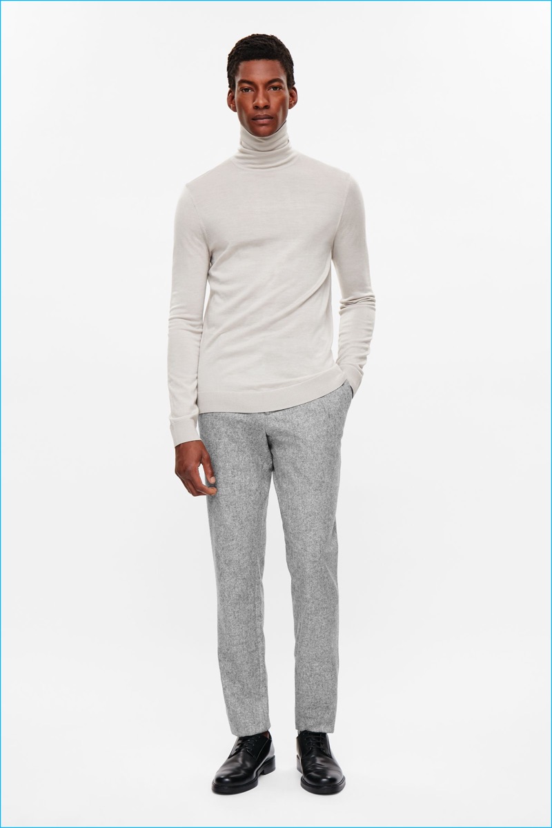 Ty Ogunkoya dons a merino wool turtleneck sweater from COS' fall-winter 2016 men's essentials collection.