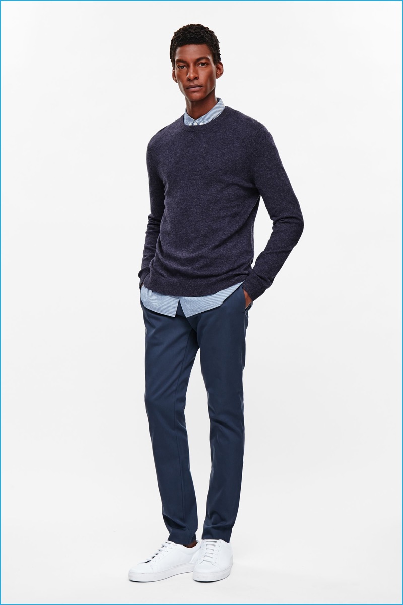 Ty Ogunkoya models a wool and yak sweater with a smart shirt and slim-fit pants from COS' fall-winter 2016 men's essentials collection.