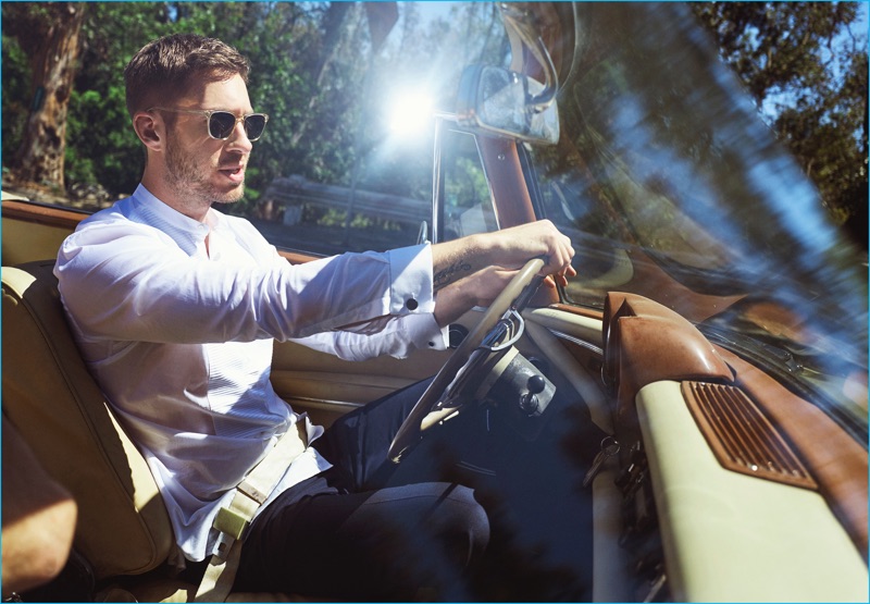 Calvin Harris goes for a drive, wearing a look from Canali.