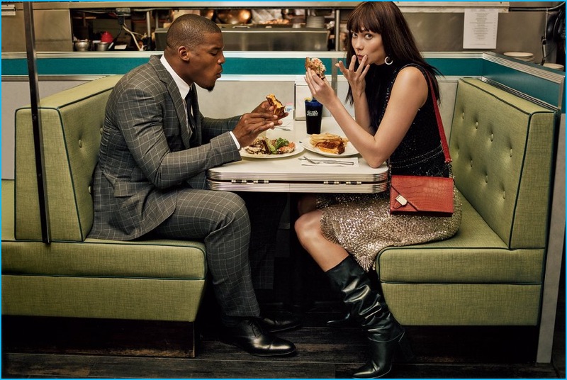 Cam Newton and Karlie Kloss enjoy a bite to eat. Newton is pictured in a Tom Ford check suit with a smart shirt and tie.