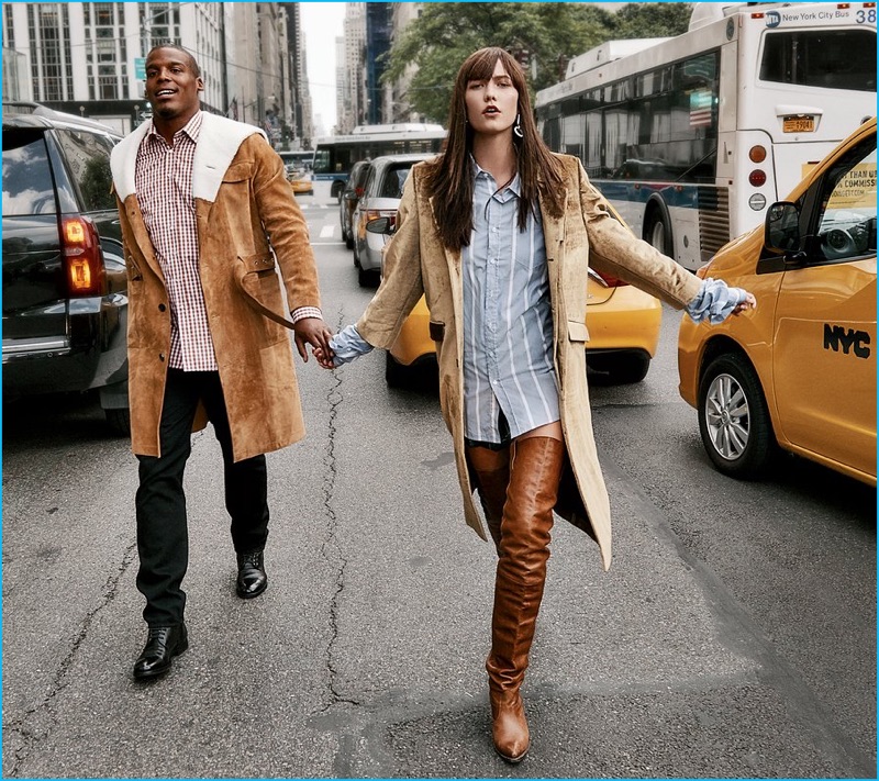 Cam Newton gets into the shearling trend with a Loewe coat. Holding hands with Karlie Kloss, Newton also wears an Etro shirt and Aidan Black shoes.