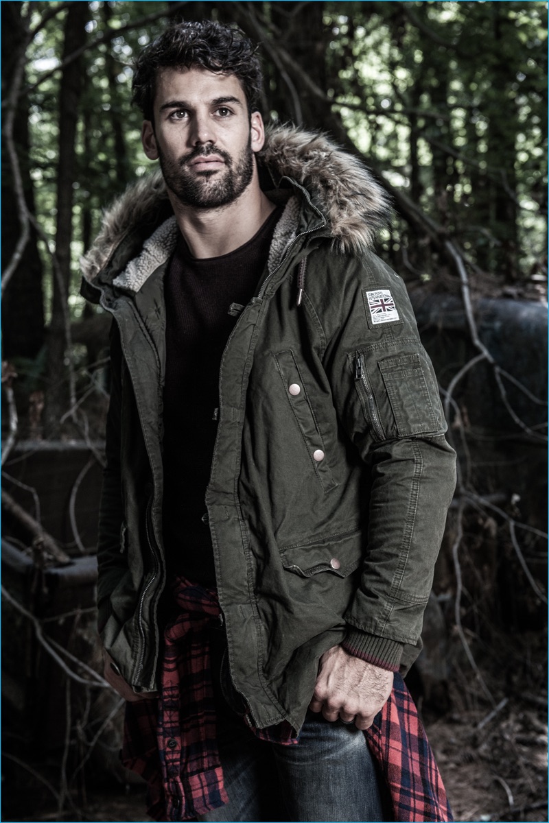 Eric Decker wears Superdry's Rookie heavy weather parka, Premium City crew sweater, milled flannel shirt, and Corporal slim jeans for the brand's fall-winter 2016 campaign.