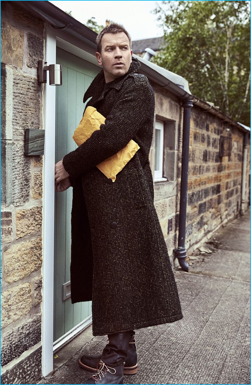 Ewan McGregor embraces modern lengths in a tweed coat from Bottega Veneta with Timberland boots.