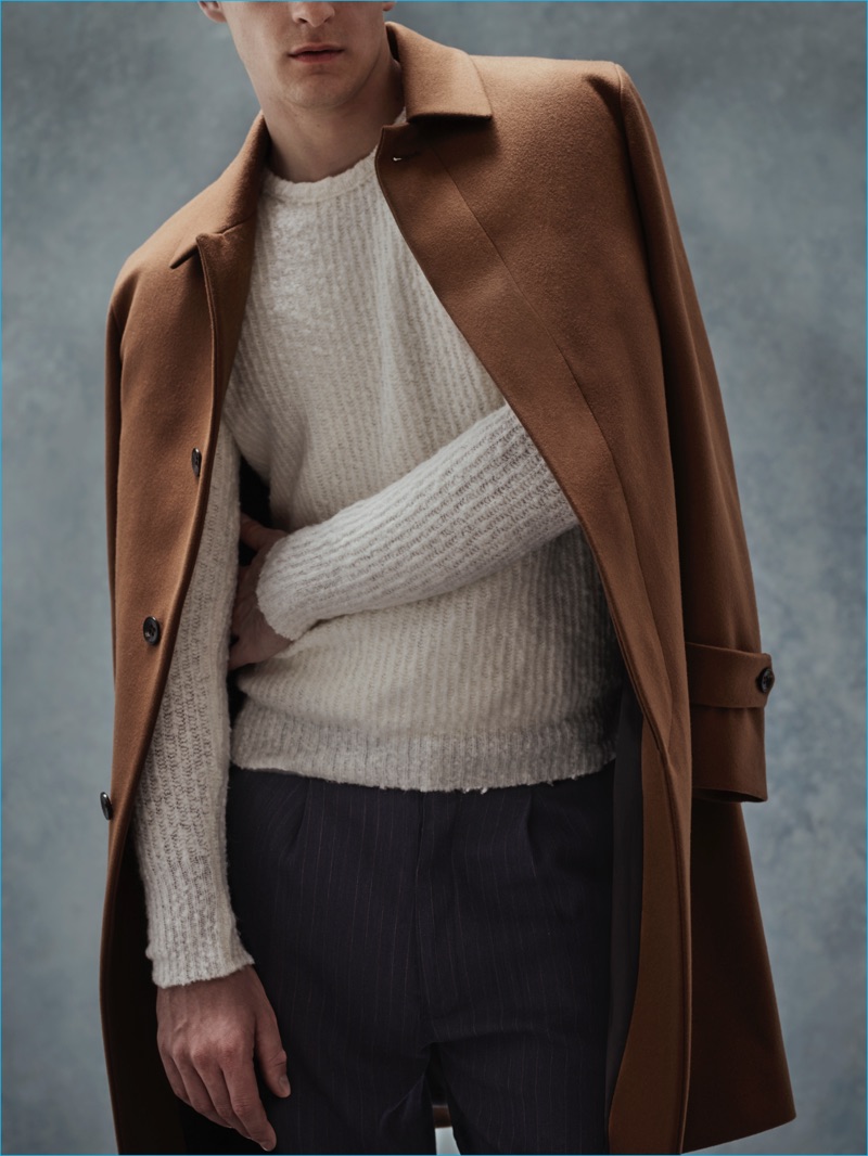 Camel & Cream: Thorben Gartner wears coat Hevo, scarf Brunello Cucinelli, sweater Nuur, and trousers Société Anonyme.