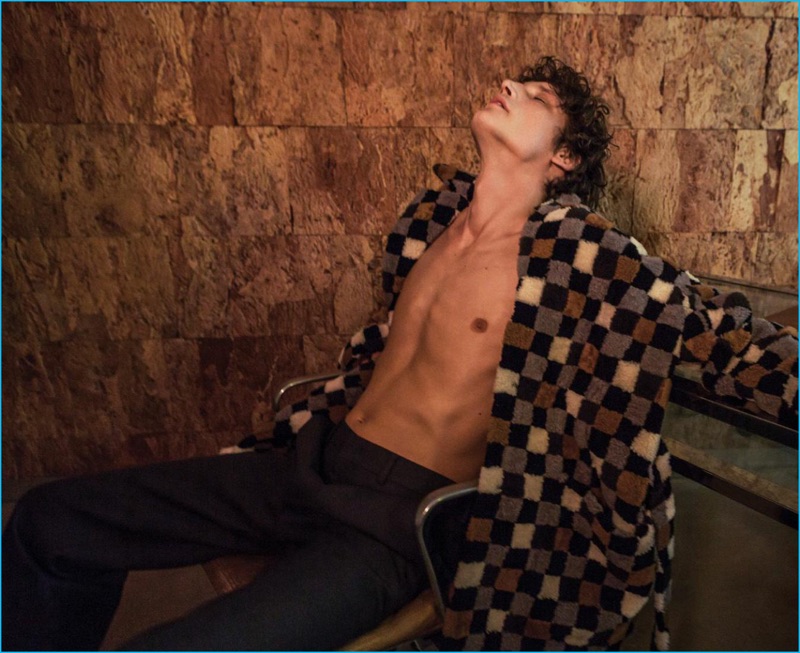 Roch Barbot rocks a check coat from Fendi for Essential Homme.
