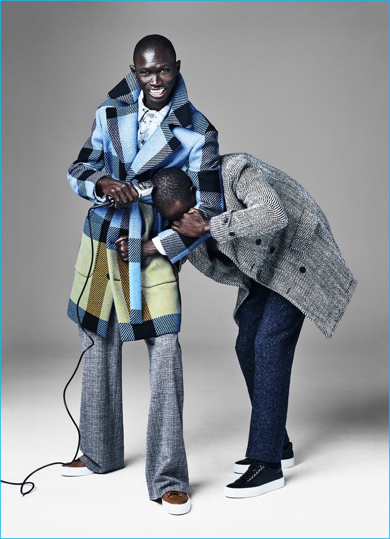 Fernando Cabral wears plaid coat Fendi, jacket Louis Vuitton, trousers Billy Reid, and sneakers Armando Cabral. Armando Cabral wears coat Hardy Amies, shirt Canali, trousers J.Crew, and sneakers Armando Cabral.