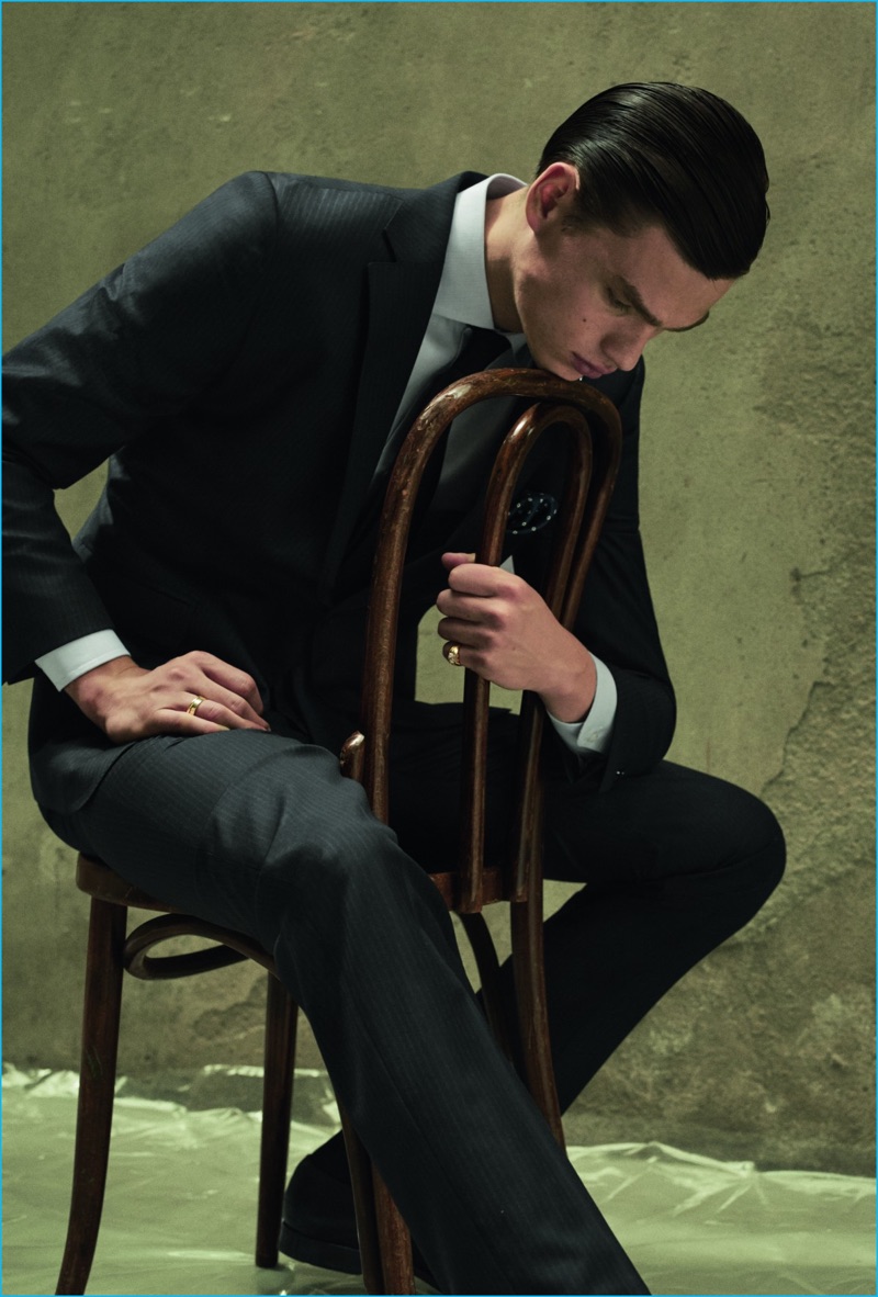 Filip Hrivnak poses for a serious fashion image, wearing a suit from Massimo Dutti.