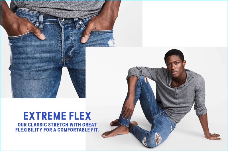 Hamid Onifade models H&M's 360 Tech Stretch Skinny Jeans in denim blue.
