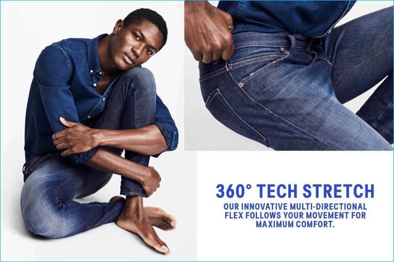 Hamid Onifade models H&M's 360 Tech Stretch Skinny Jeans in dark denim blue.
