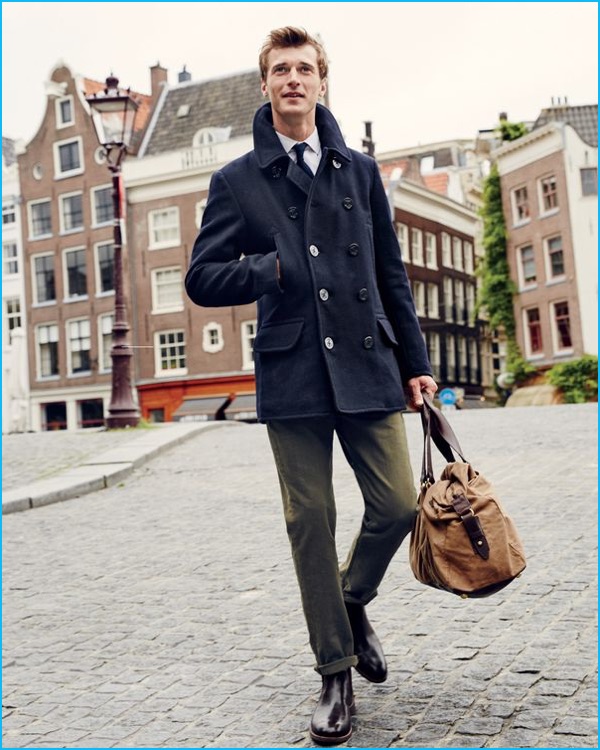 Clément Chabernaud takes to the streets of Amsterdam in a navy peacoat from J.Crew.