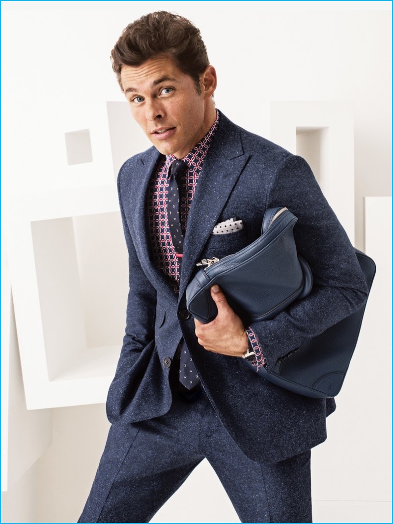 James Marsden suits up in blue, donning a Canali suit with a Burberry shirt, Dolce & Gabbana tie, Peter Millar pocket square Rolex watch, and leather Louis Vuitton briefcase.