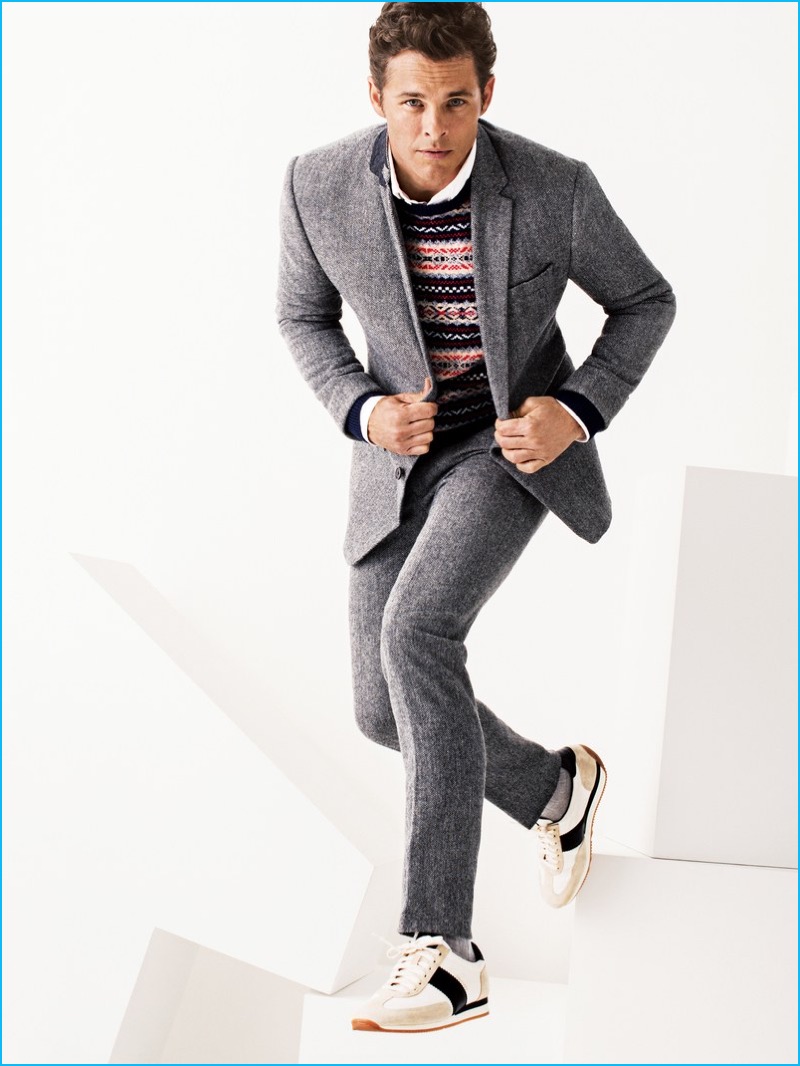 James Marsden is on the move in a Joseph Abboud suit with a J.Crew sweater, Hamilton Shirts shirt, Tom Ford sneakers, and Pantherella socks.