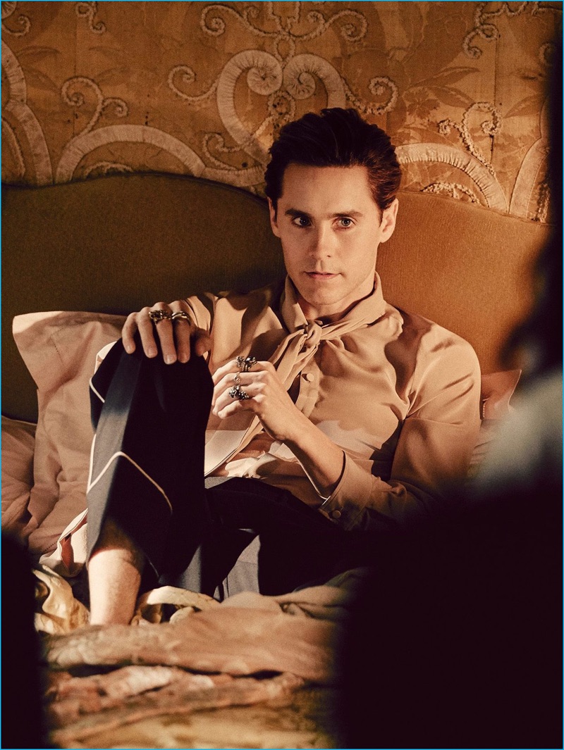 Behind the Scenes: Wearing a silk shirt and scarf from Gucci, Jared Leto relaxes in bed for Gucci Guilty's fragrance campaign.