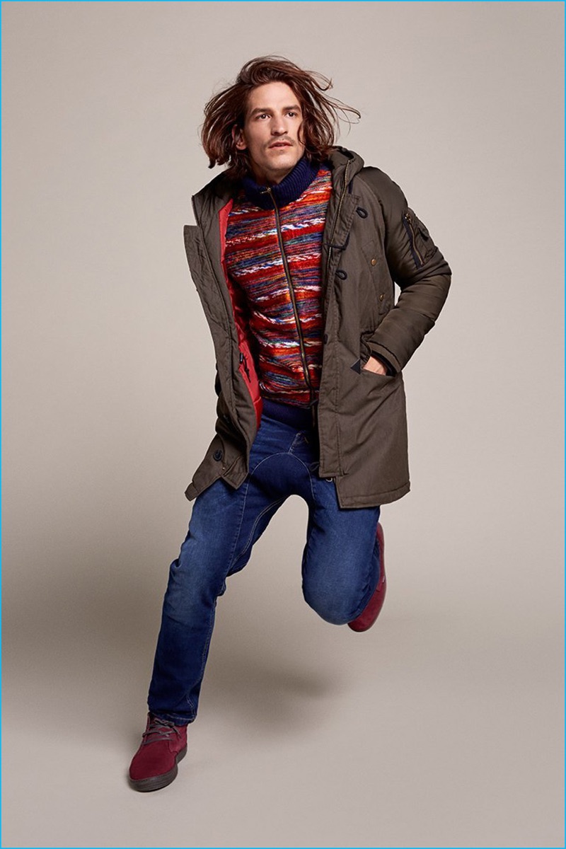 Jarrod Scott embraces casual style in a parka and jeans from Desigual's latest men's collection.