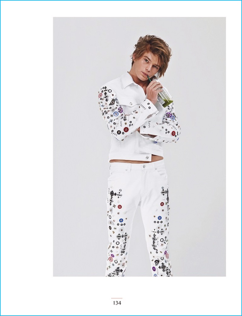 Jordan Barrett wears a flashy white look from Versace for Narcisse magazine.