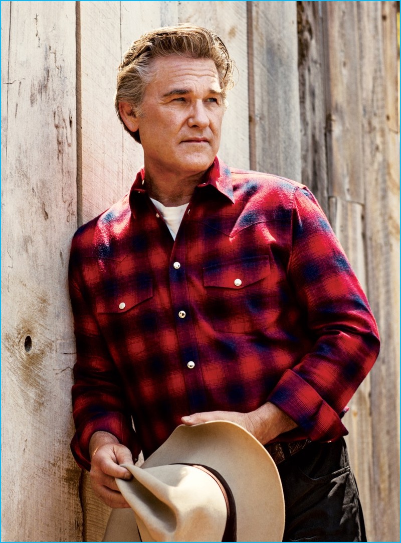 Kurt Russell poses in a Givenchy shirt with a Levi's Vintage Clothing t-shirt and vintage Stetson hat for GQ.
