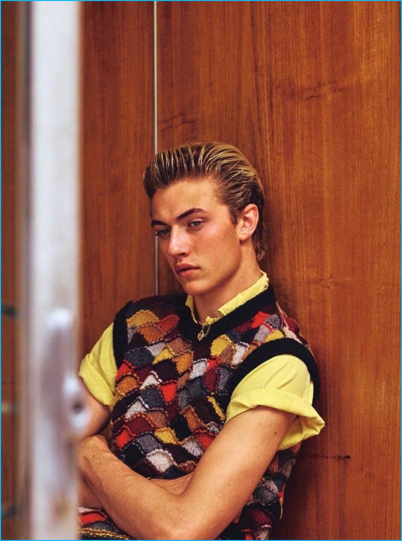 Lucky Blue Smith dons a retro-inspired sweater vest from Prada's fall-winter 2016 collection.