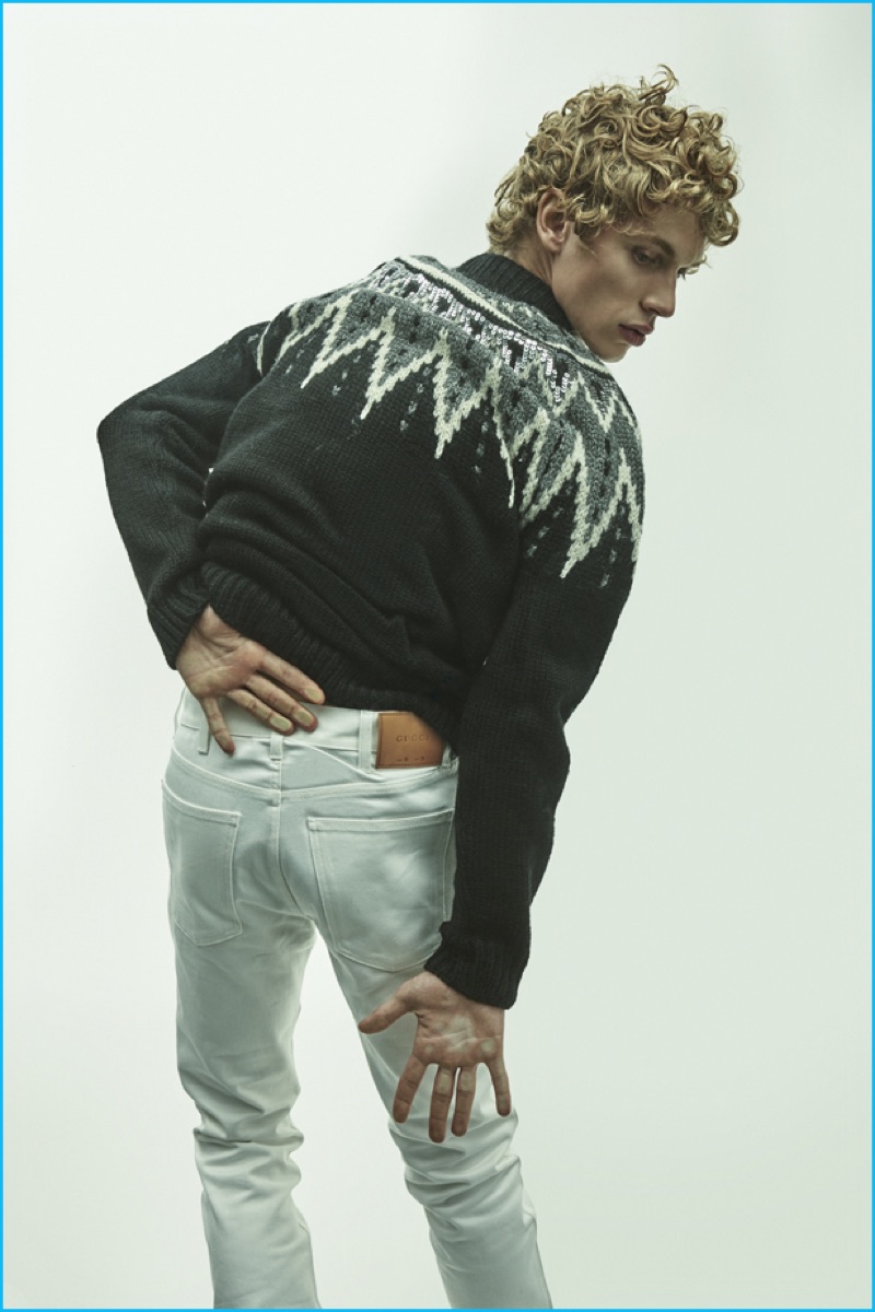 Robbi wears sequined Norwegian wool sweater Saint Laurent and 16.5 white cotton denim jeans Gucci.